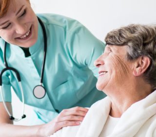 Doctor and older female patient